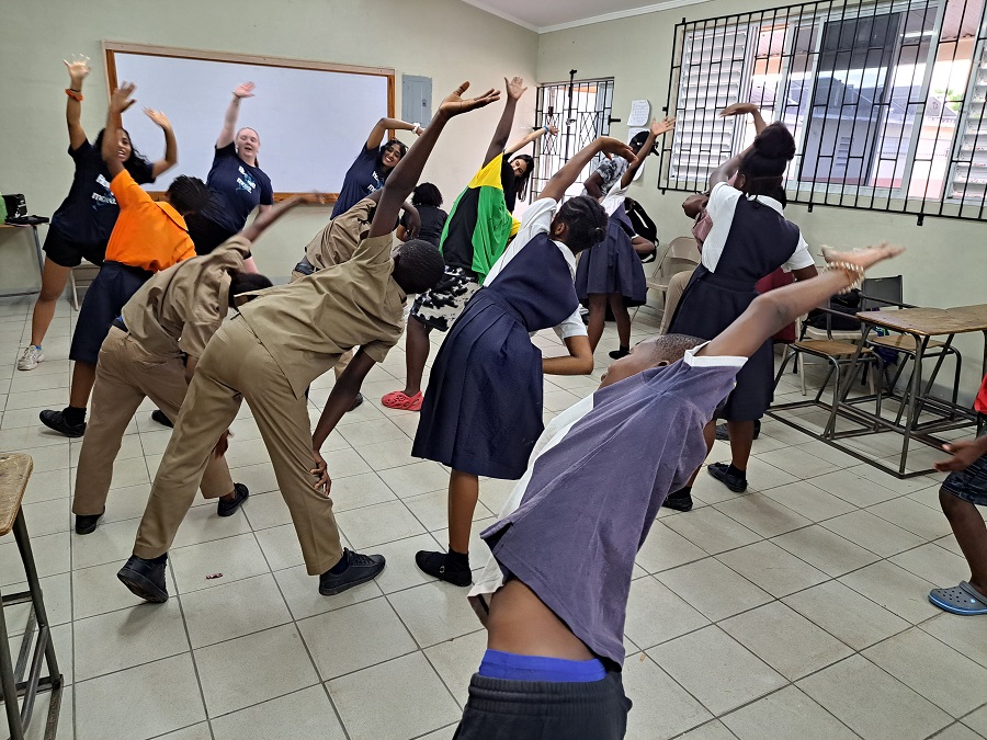 3 KPE students lead physical activity session in classroom of Jamaican children