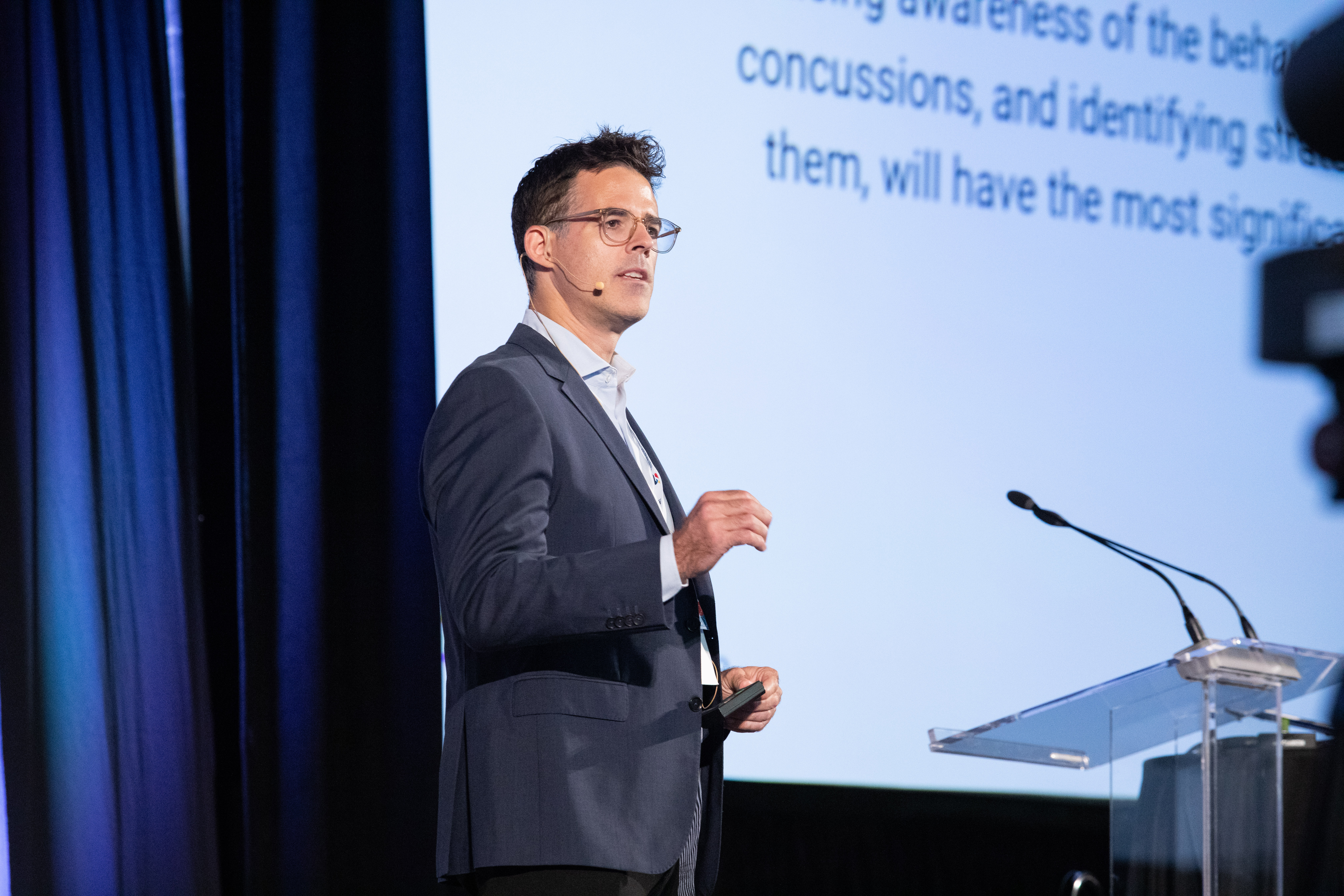 mike hutchison presenting on conference stage