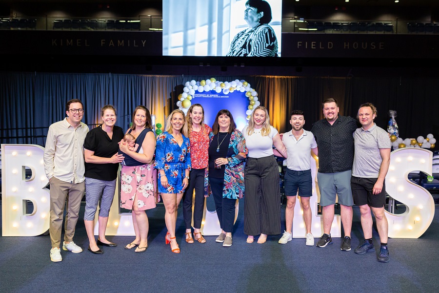 Group photo of Beth Ali w/ colleagues and teammates