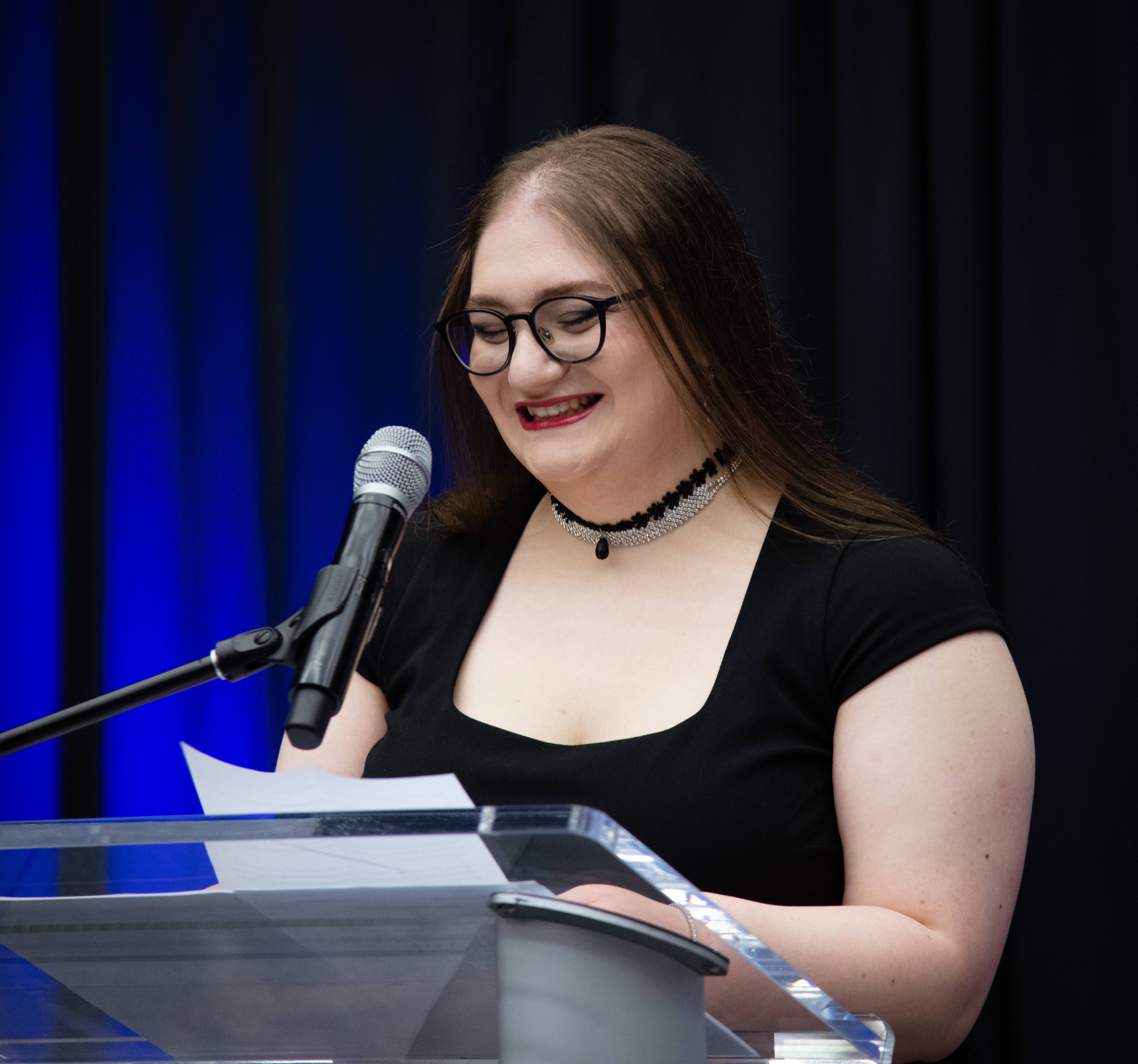 Emma Karanlian at podium during reception