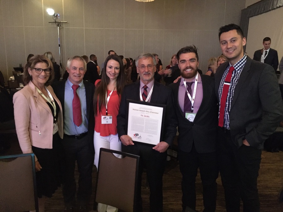 Dean Jacobs is flanked by KPE students and professors following the CSEP Awards ceremony