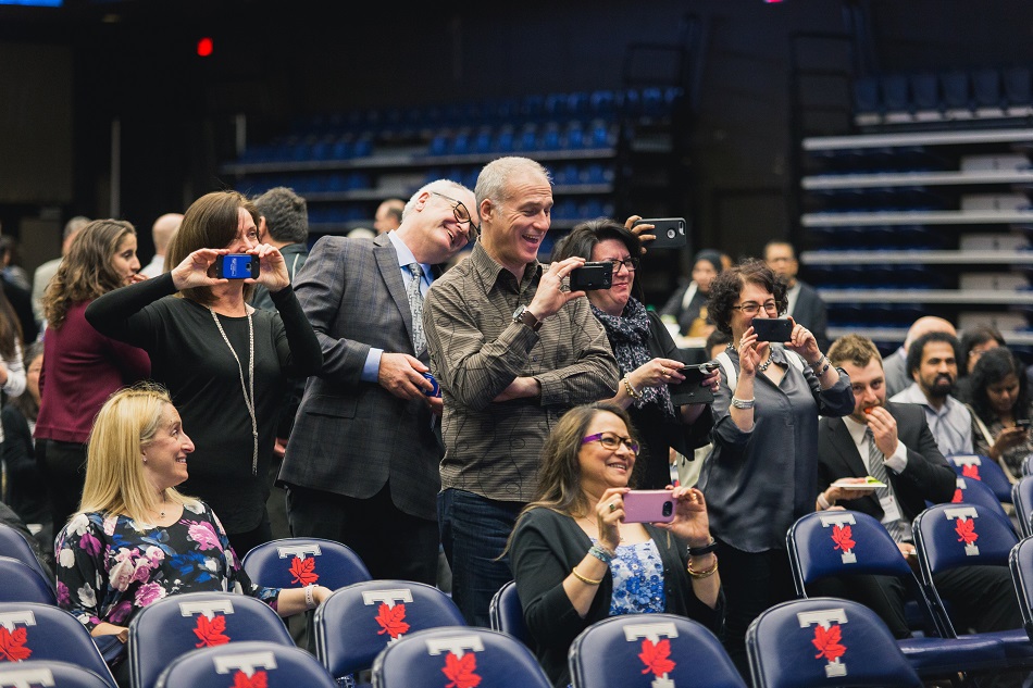 exuberant parents snapping pictures (photo by Arnold Lan)