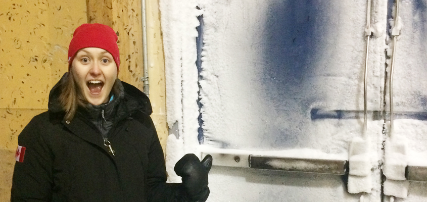 Zoe Poucher pointing to the frozen arena doors