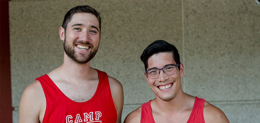 Two Camp U of T staff members smiling at the camera