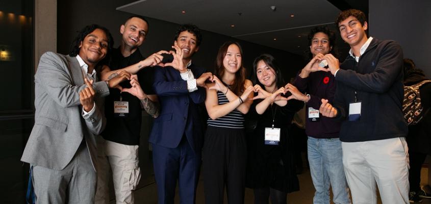 A picture of KPE students showing the heart sign